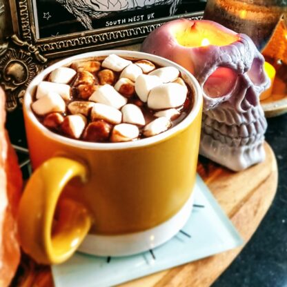 Mug of Luxury Vegan Hot Chocolate and Marshmallows and Skull Candle